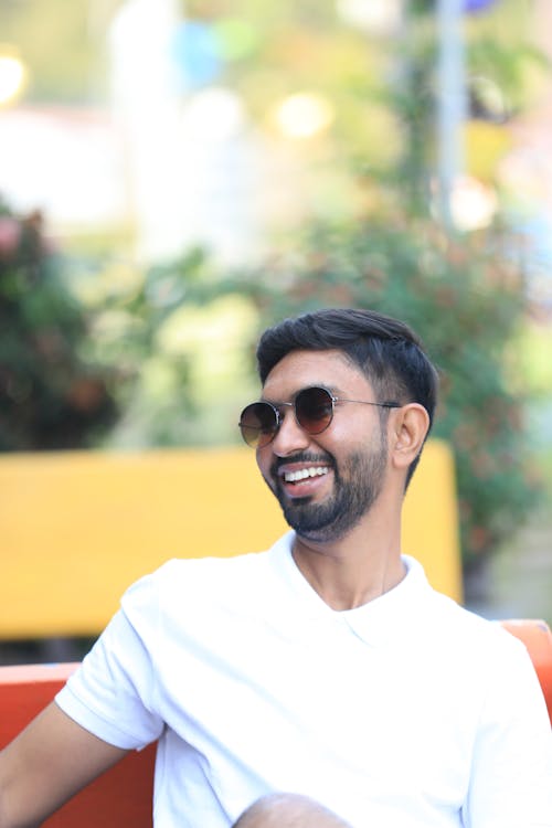 Smiling Man in Sunglasses and White T-shirt