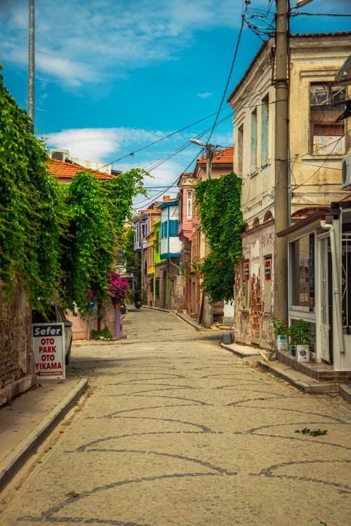 Free Explore the quaint cobblestone streets of Ayvalık, Türkiye, with vintage architecture. Stock Photo
