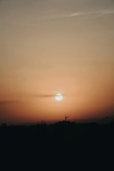 A serene sunrise over the skyline of Talgar, Almaty Province, Kazakhstan.