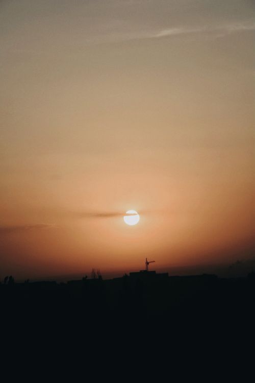 Free A serene sunrise over the skyline of Talgar, Almaty Province, Kazakhstan. Stock Photo