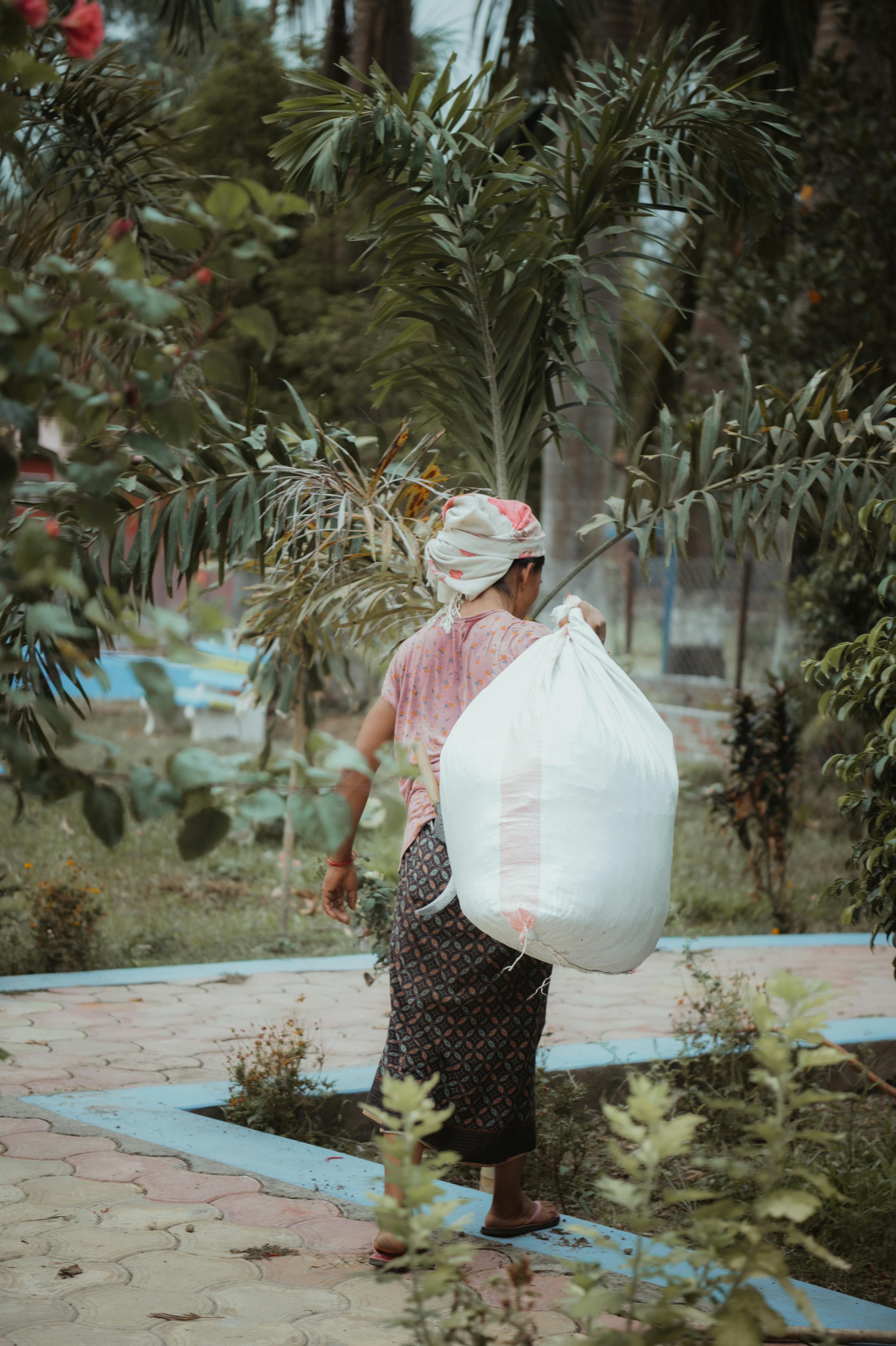 woman carrying bag at park