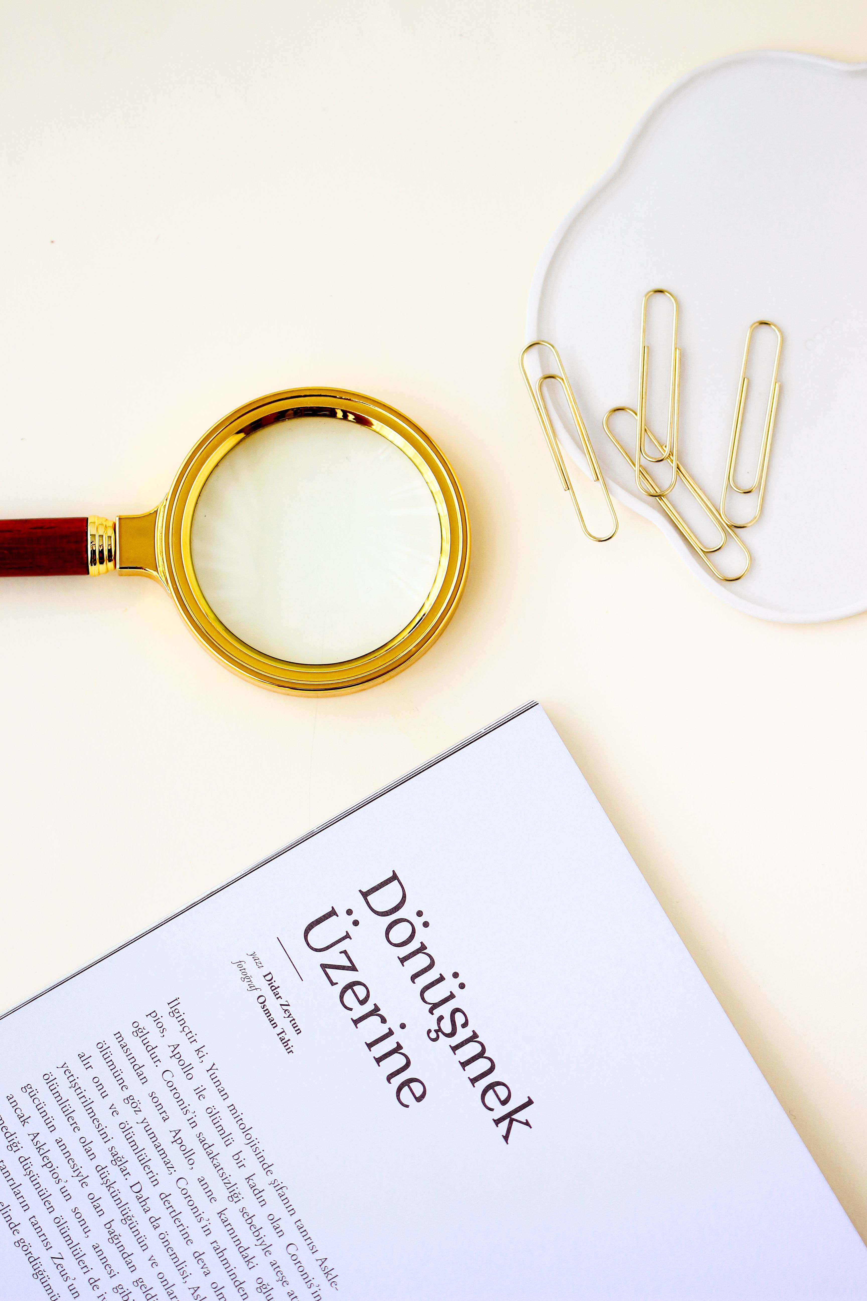 A magnifying glass laid across a printed financial document