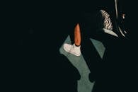 Leg in White Trainers