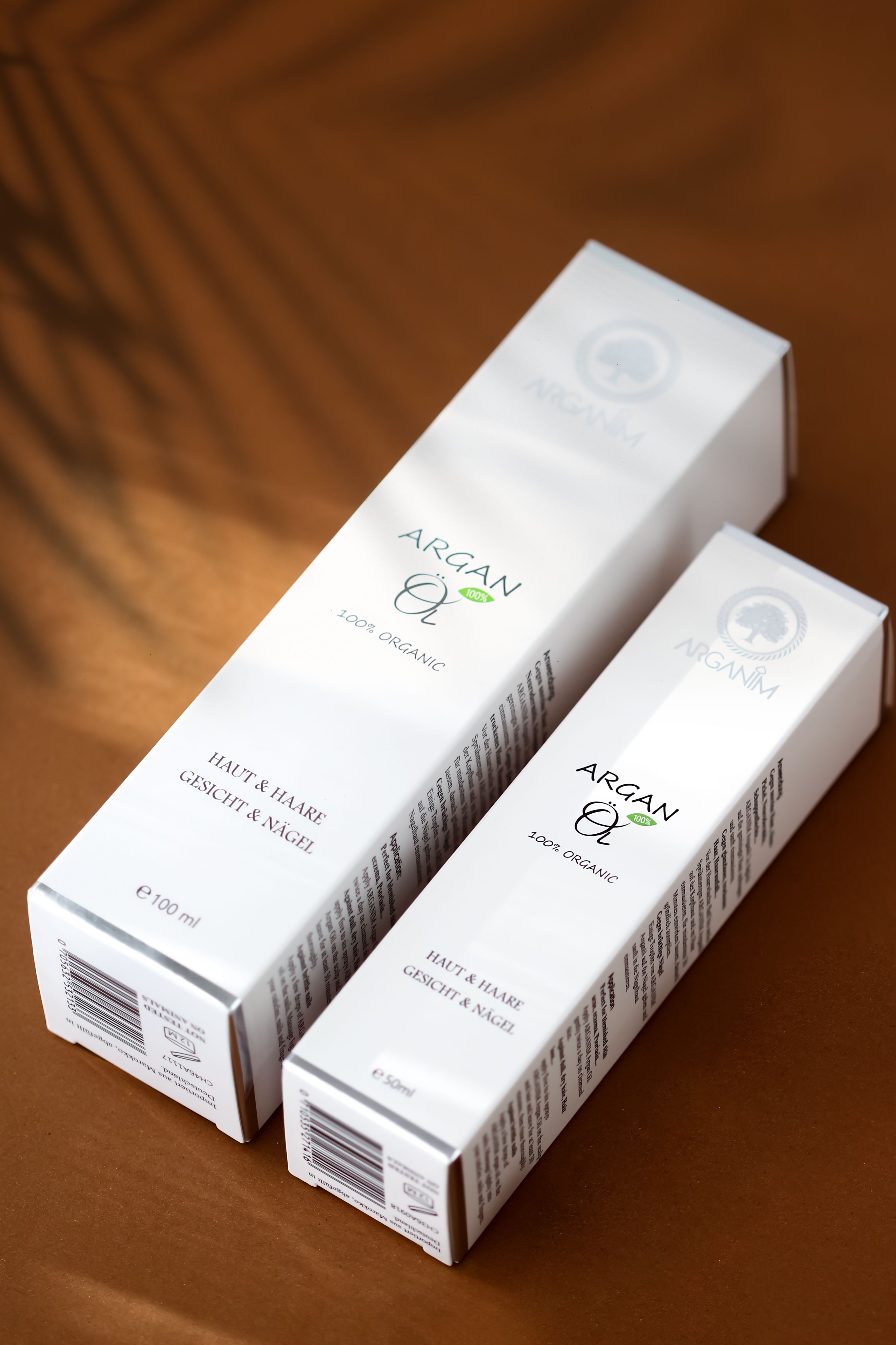 Studio shot of argan skincare product boxes with elegant design, perfect for beauty marketing.
