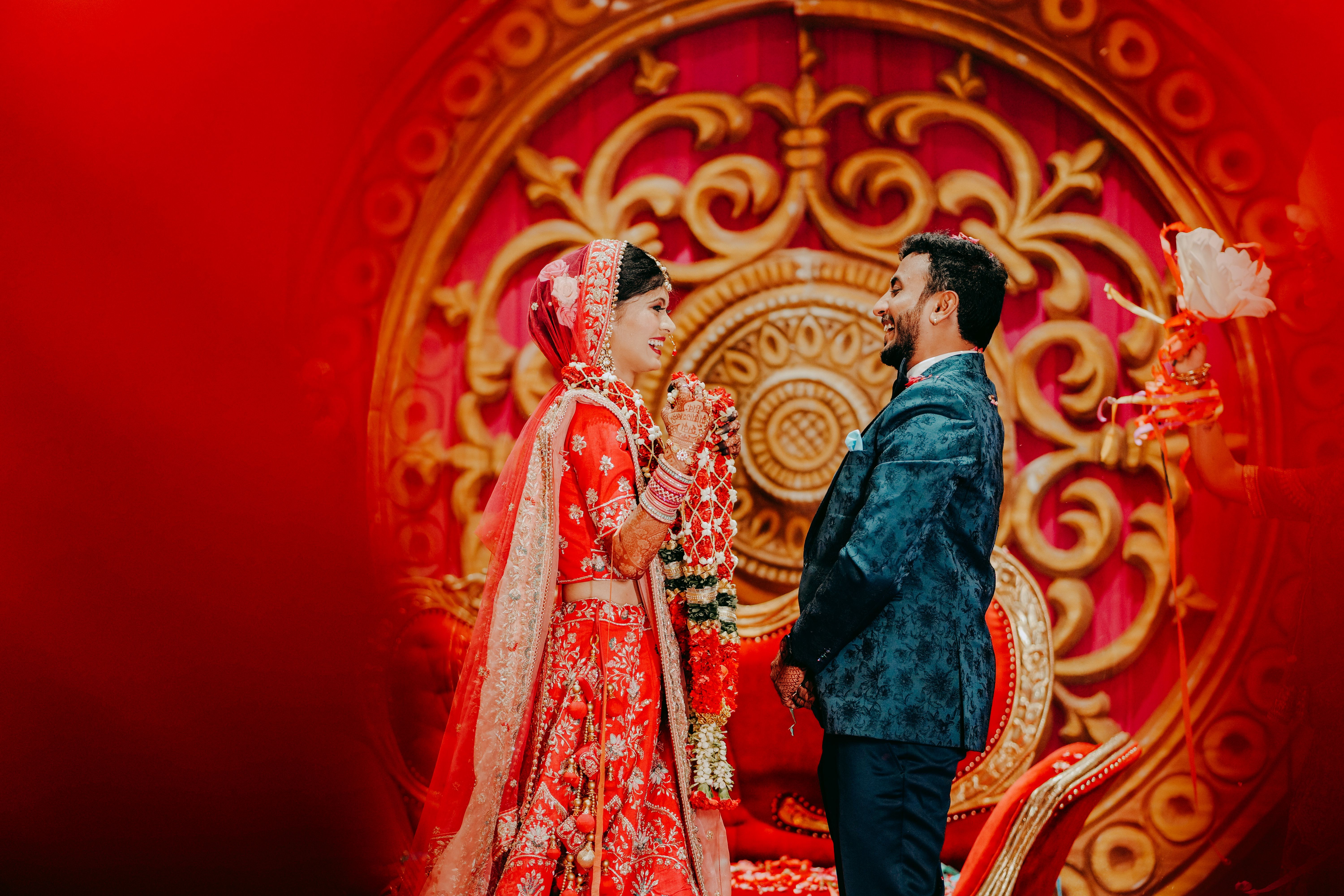 Lively capture of a joyful Indian bride and groom during their wedding ceremony in Durg, India.