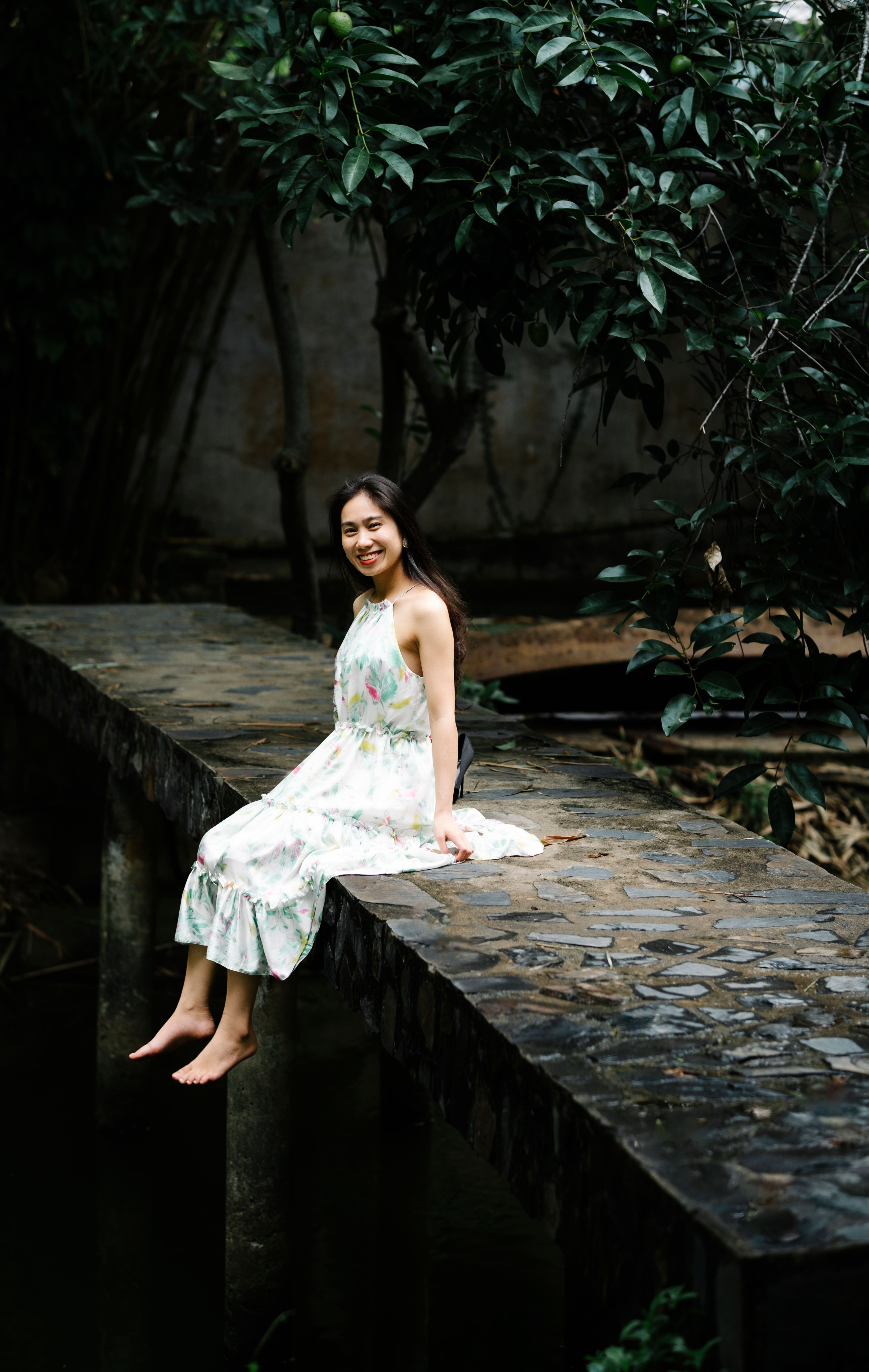 Woman in a White Dress Sitting on a Wall · Free Stock Photo