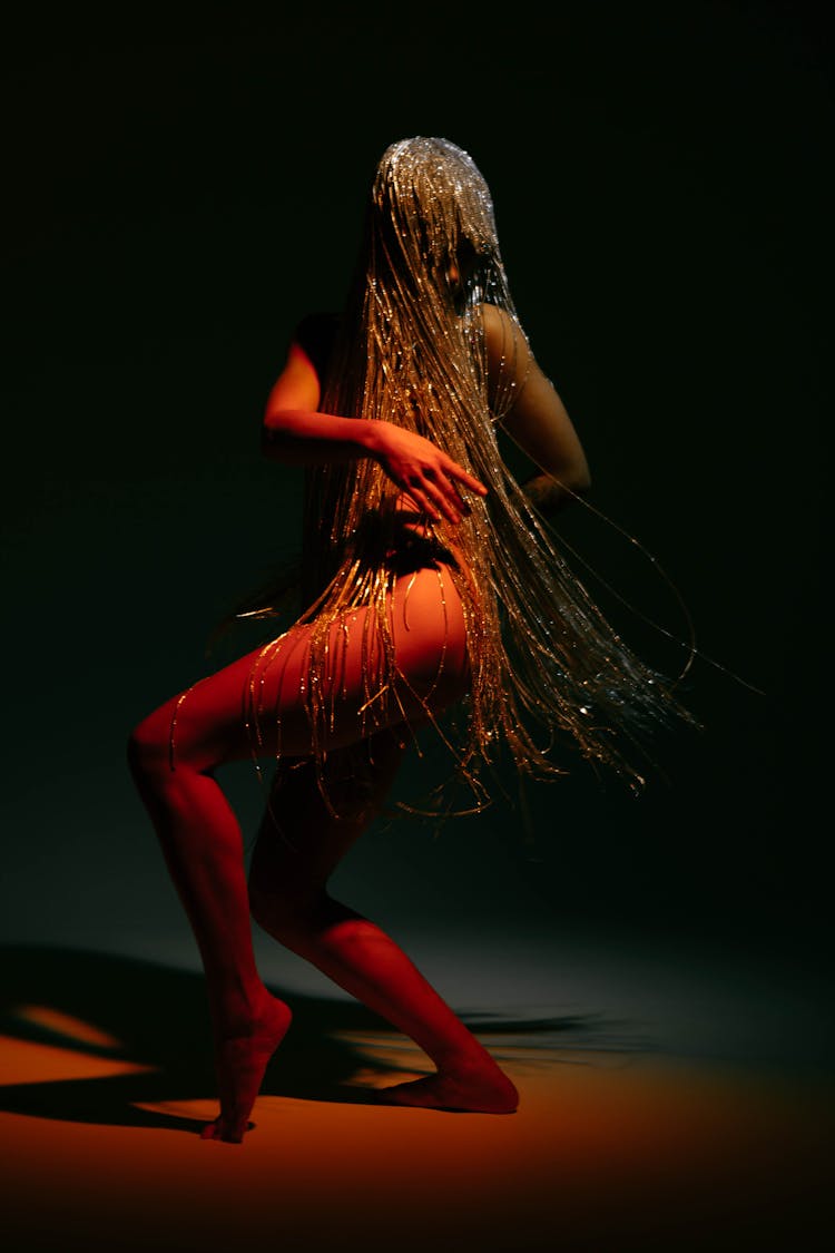 Dancer In A Long Silver Wig