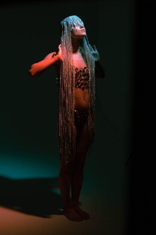Studio Shot of a Woman Wearing a Long Head Chain 