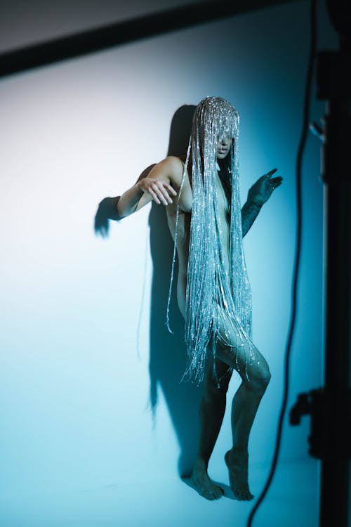 Studio Shot of a Woman Wearing a Long Head Chain 