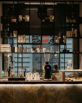 Cozy coffee shop interior in Baku, featuring coffee equipment and a modern setup.