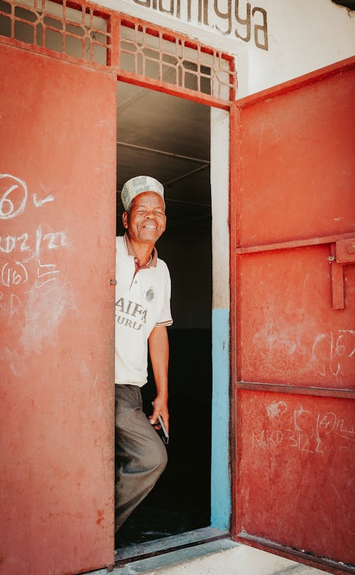 Smiling Baker Standing in Doorway