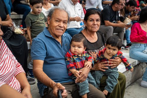 Free A joyful family moment captured with grandparents and grandchildren enjoying an outdoor gathering. Stock Photo