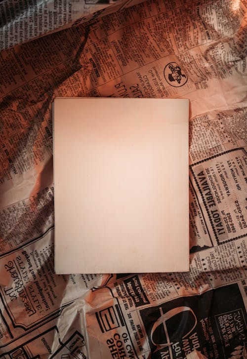 Blank Pages on a Crumpled Newspaper