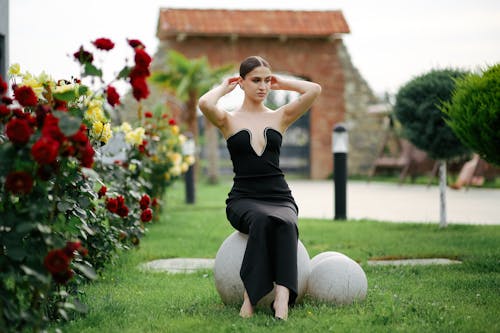 Young Elegant Woman Posing in the Garden 