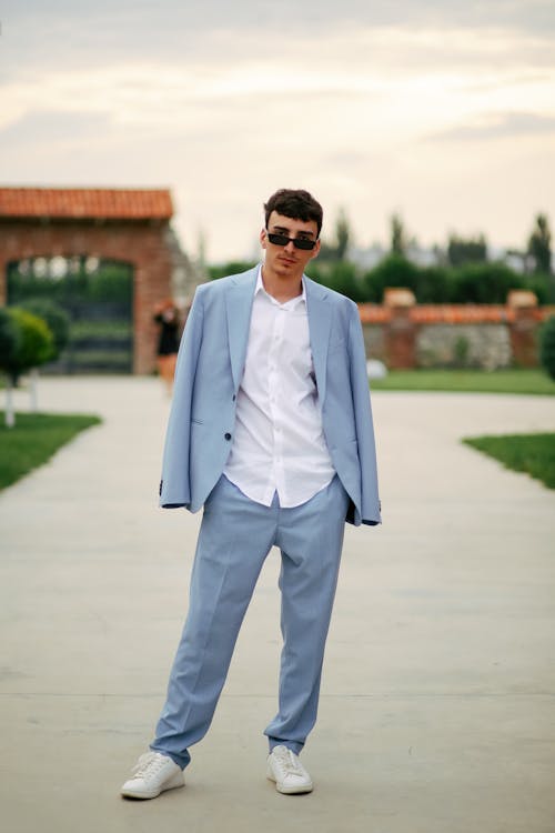 Young Man in a Suit Posing Outside 