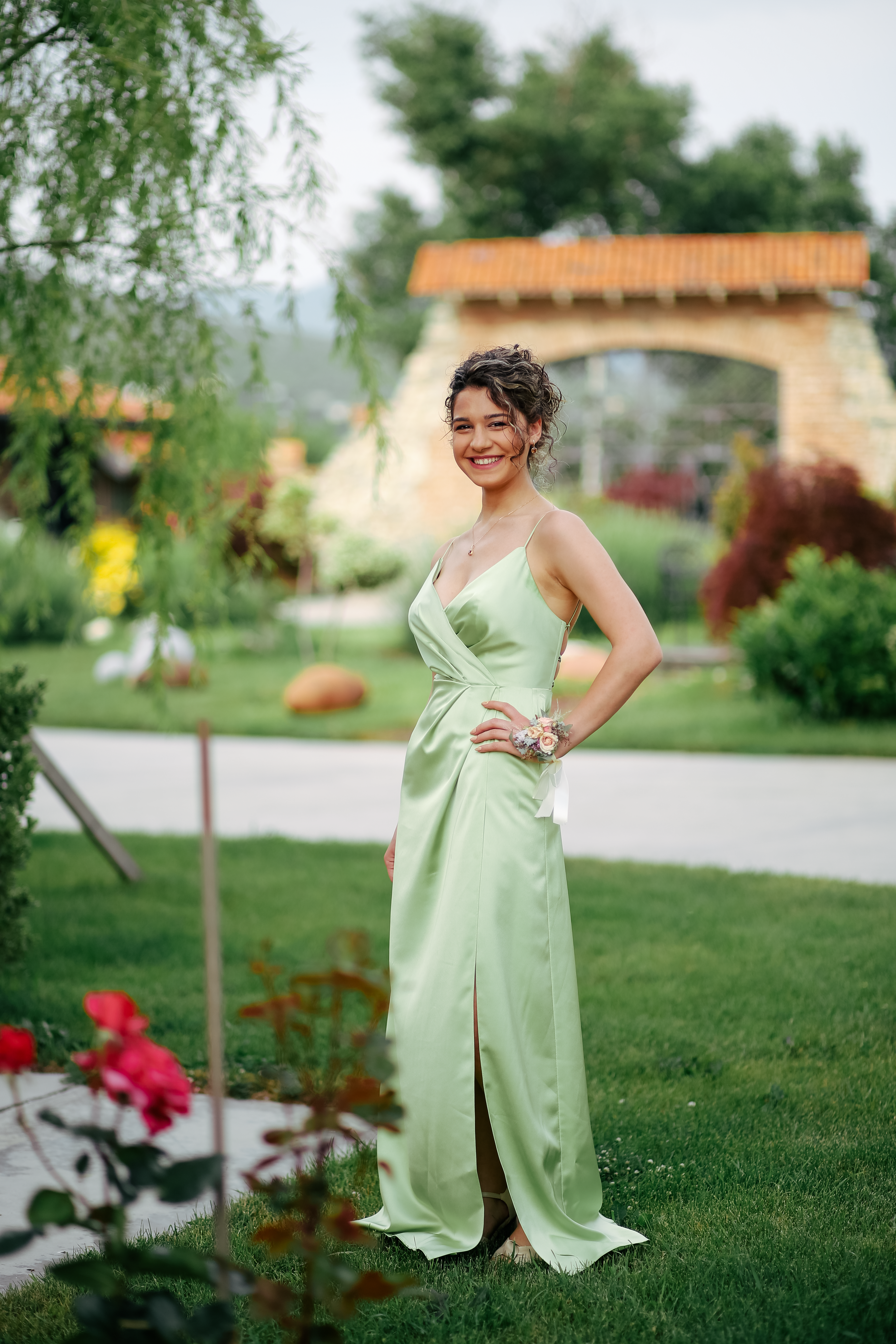 Smiling Woman Standing on Lawn in Green Dress · Free Stock Photo