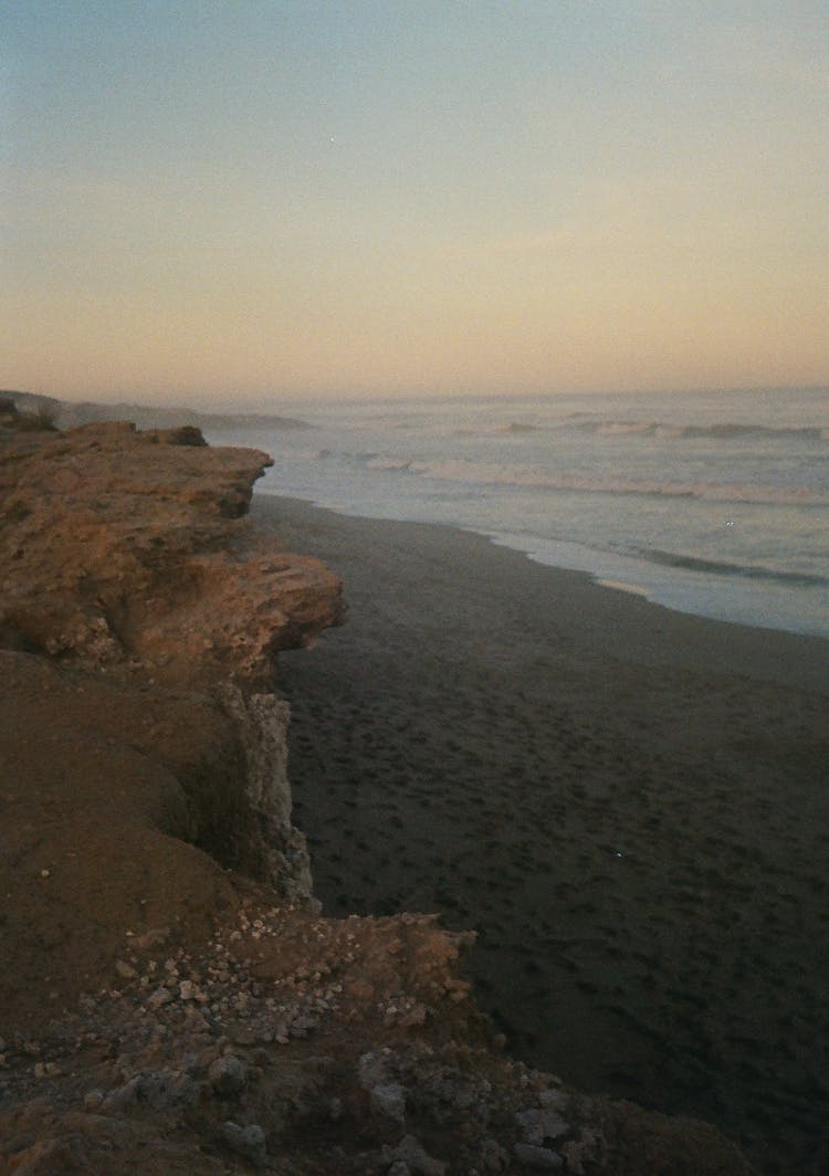 Cliffs And The Beach At Sunset 