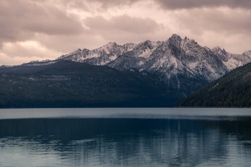 Free Landscape Photography of Mountain Alps Near Body of Water Stock Photo