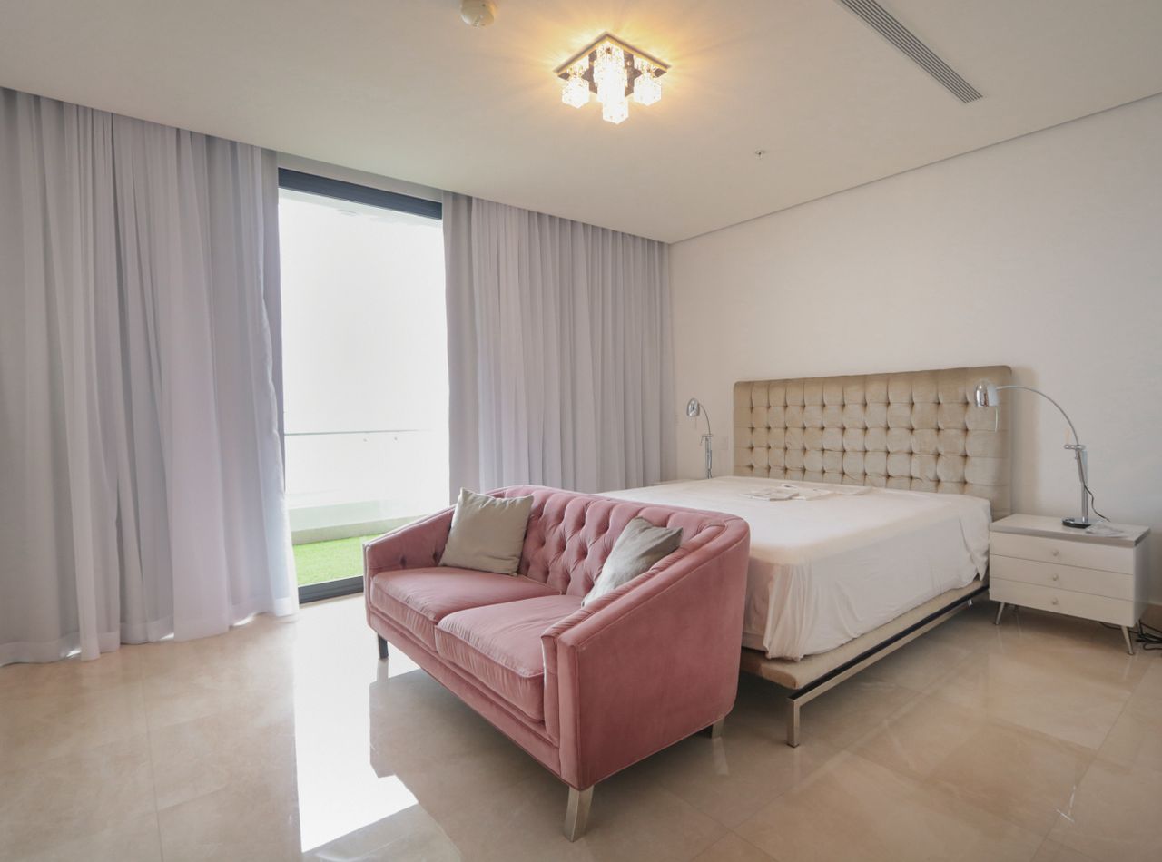 multi-functional-furniture-living-room Convertible sofa bed setup in a bright room