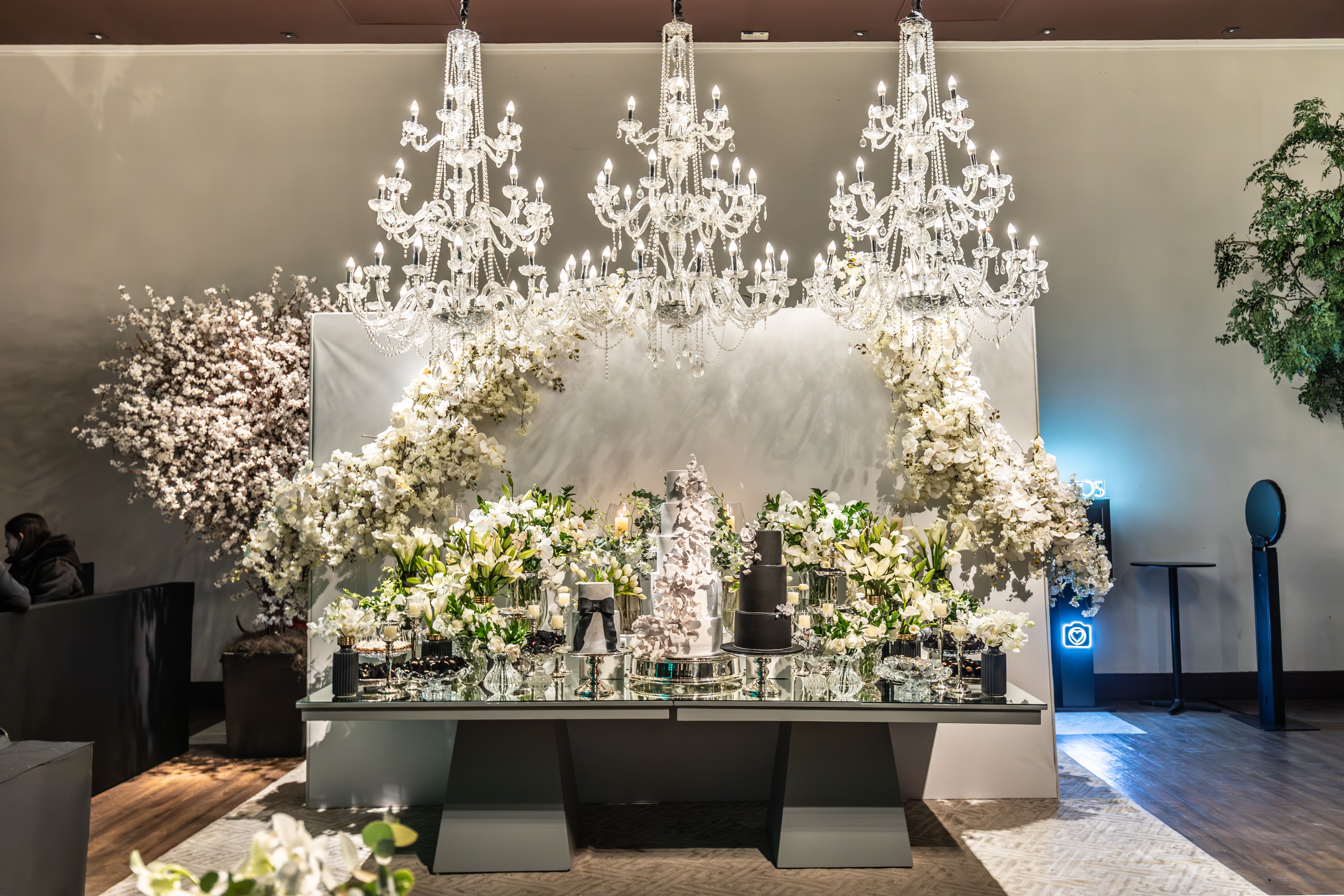 Luxury reception with chandeliers and lavish floral arrangements