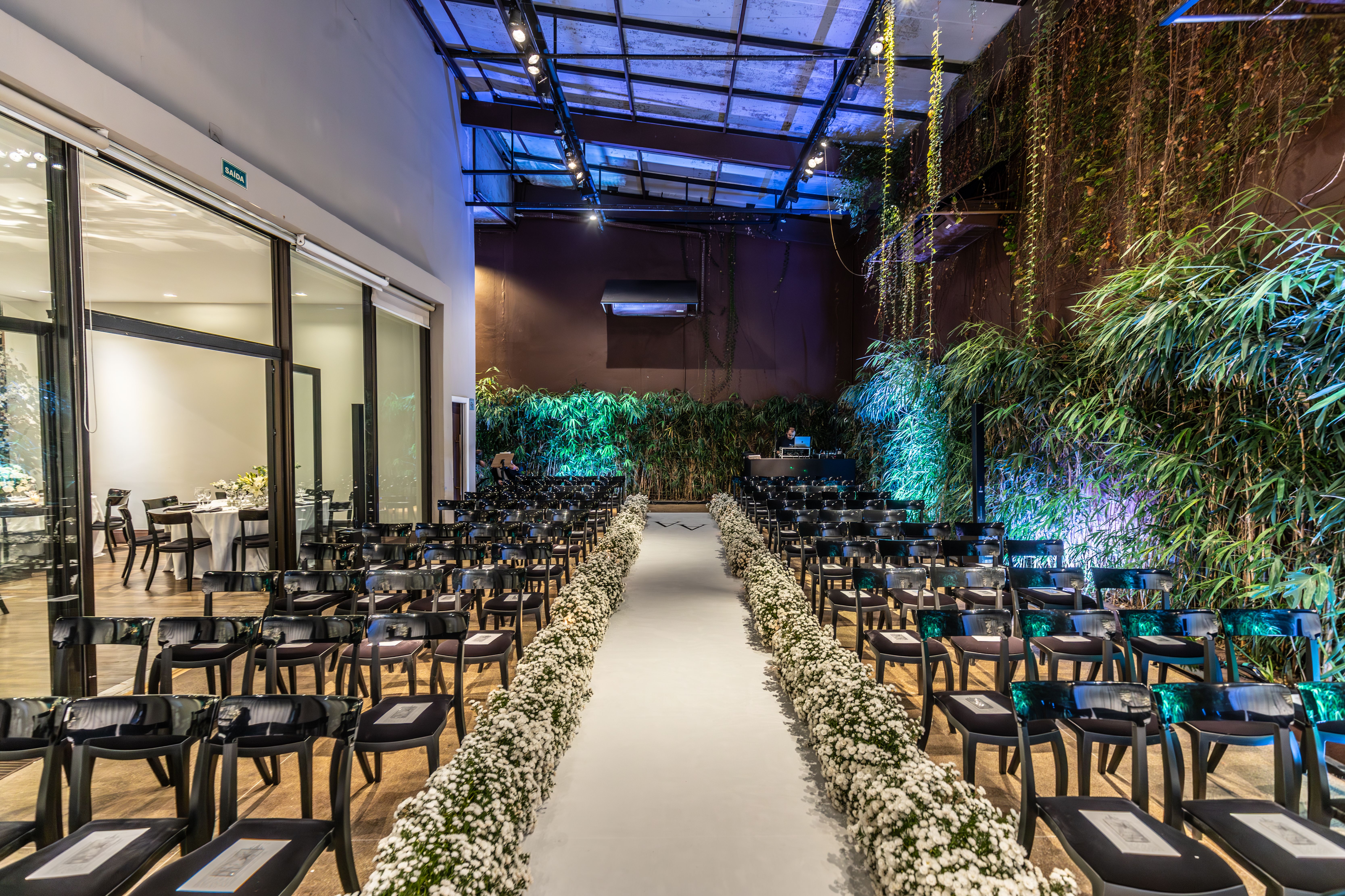 Bright indoor wedding venue with floral arrangements