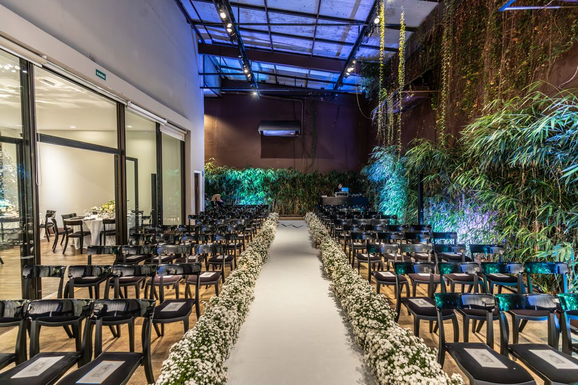 Bright indoor wedding venue with floral arrangements