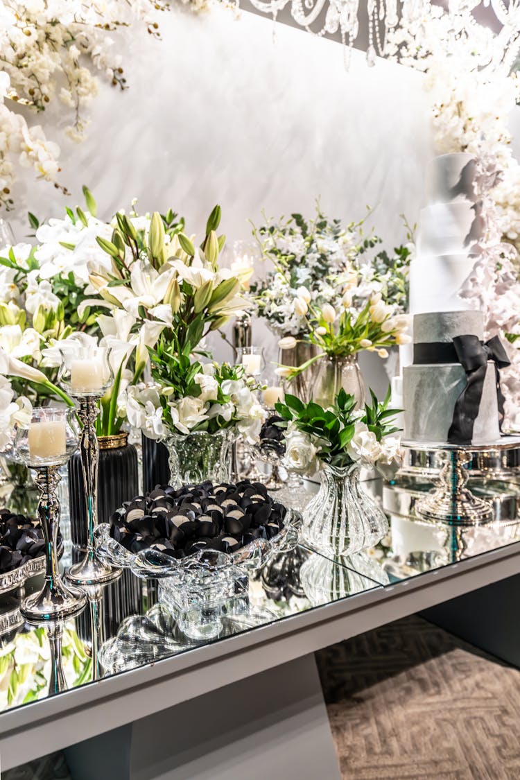 Table With Sweets Among Flowers