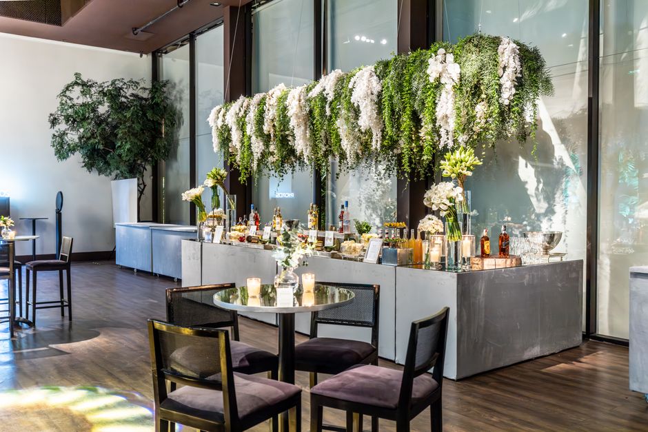 Beautifully decorated reception venue with floral arrangements and ambient lighting.