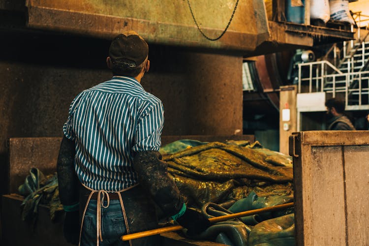 Back View Of Man Working At Factory