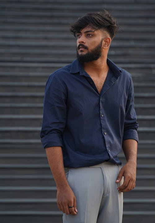 Model in a Navy Blue Shirt and Gray Pants 