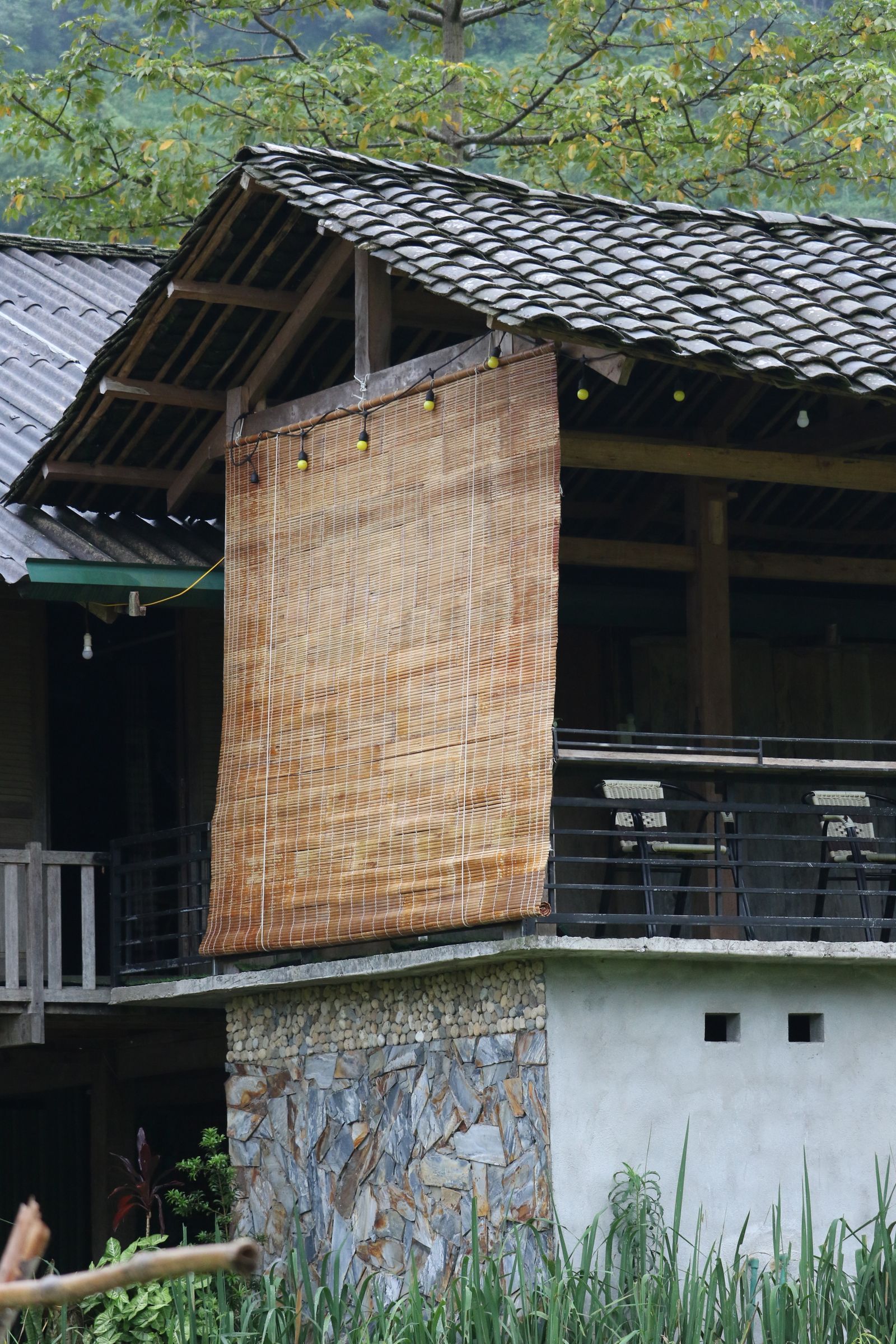 Traditional village building in Ha Giang showing the Easy Rider role as cultural translator