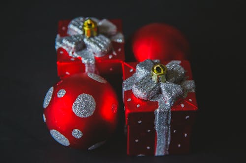 Close-Up Photo of Red And Silver Christmas Decorations