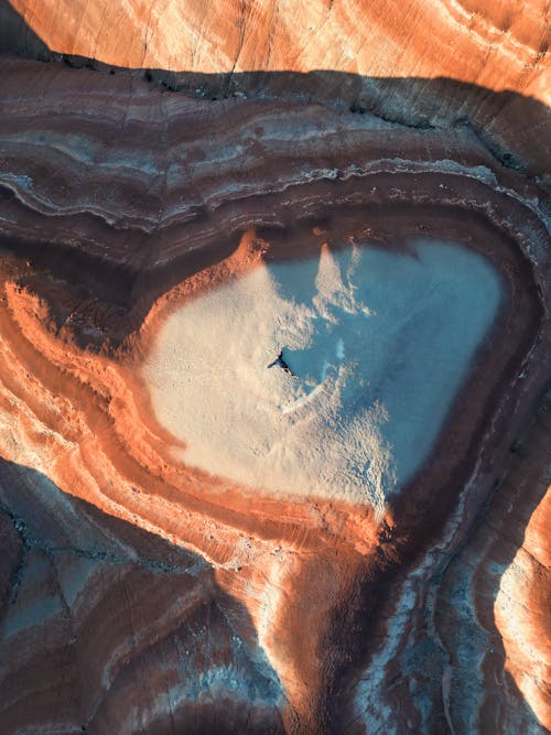 Person Lying Down on Barren Desert