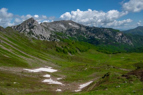Free Breathtaking view of Montenegro's rugged mountains and lush valleys under a bright sky. Stock Photo