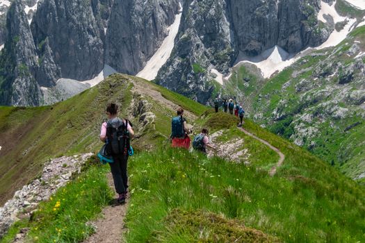 A group of hikers exploring the breathtaking mountain trails of Montenegro.