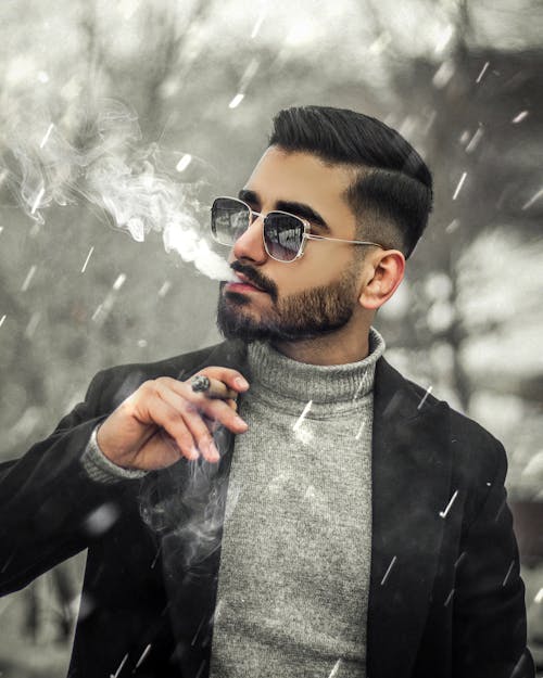 Brunette Man in Suit Jacket Smoking Cigar