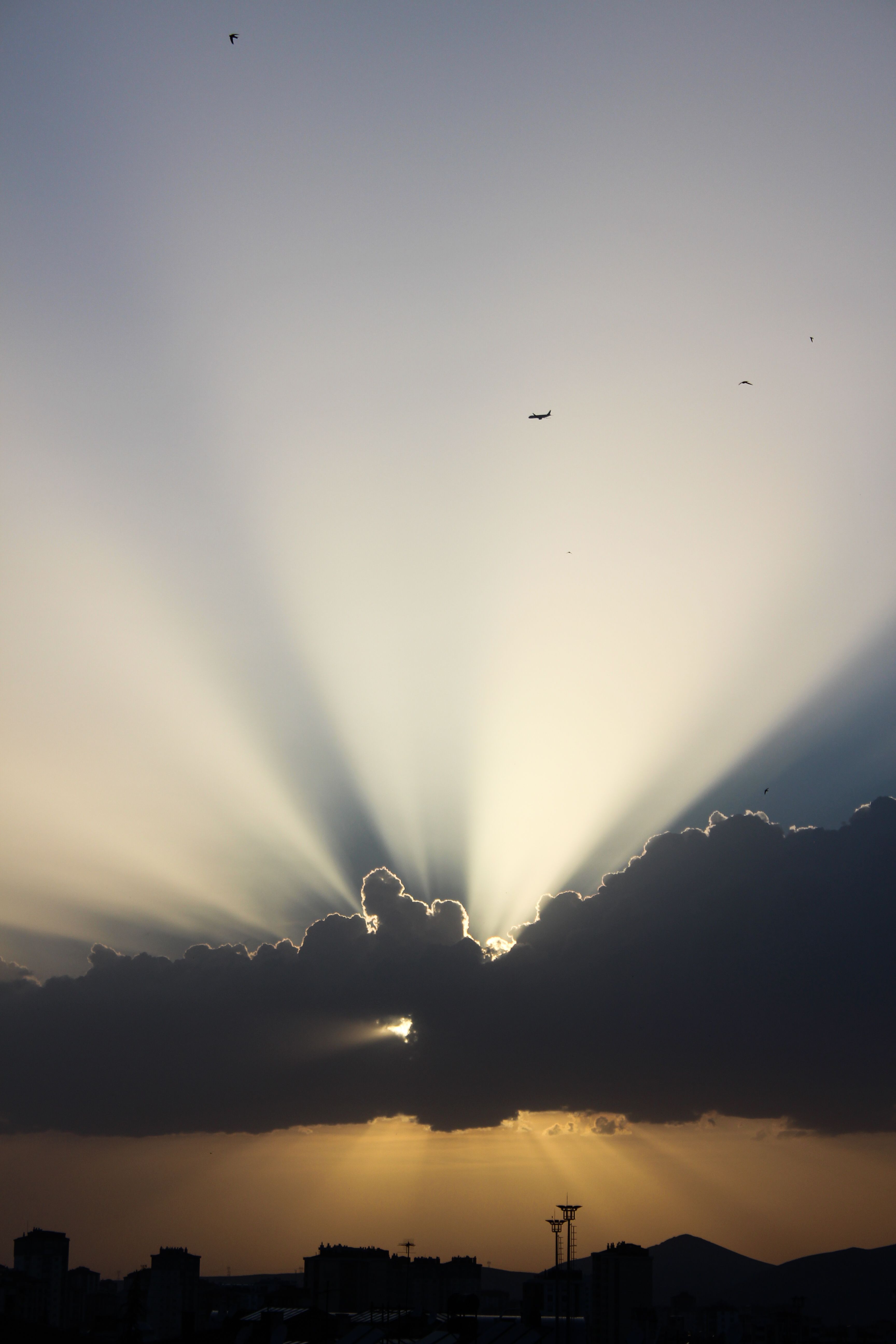 Sunbeams over Cloud on Sky at Sunset · Free Stock Photo