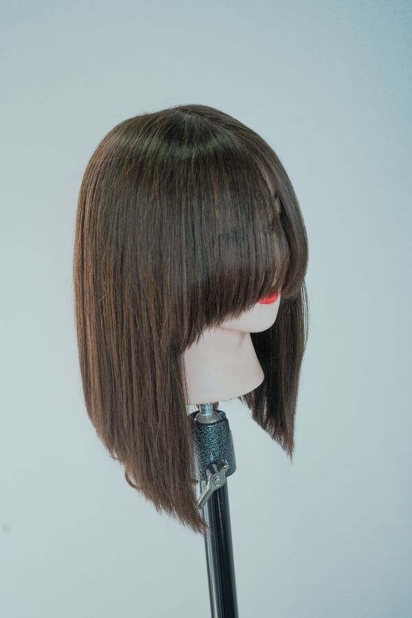 Long straight wig on a mannequin head