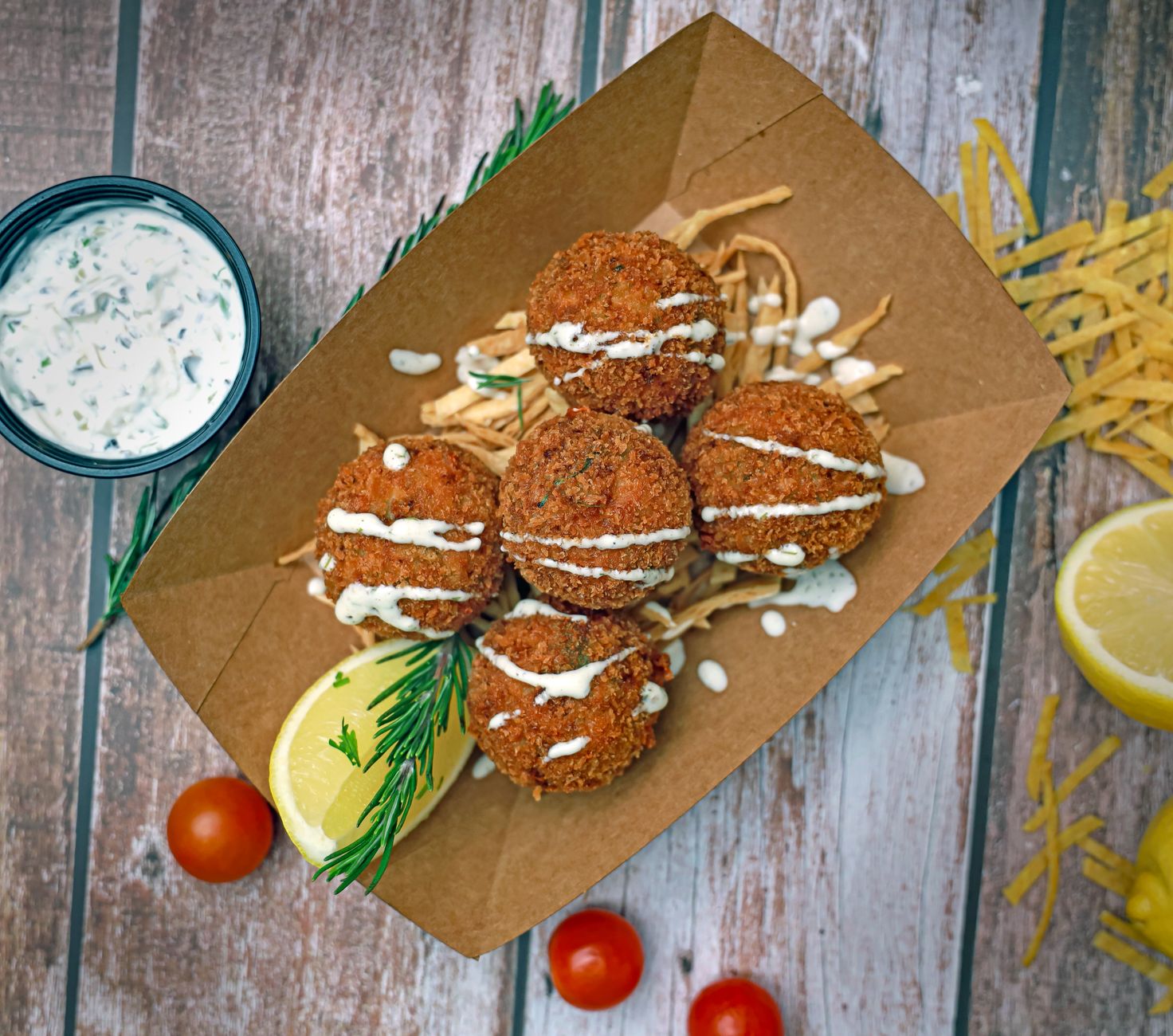 Golden fried Dixie Blue Crab and Corn Hush Puppies on a plate