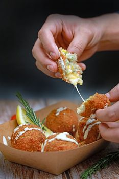 Delicious crispy arancini with melted cheese filling. Perfect appetizer or snack.