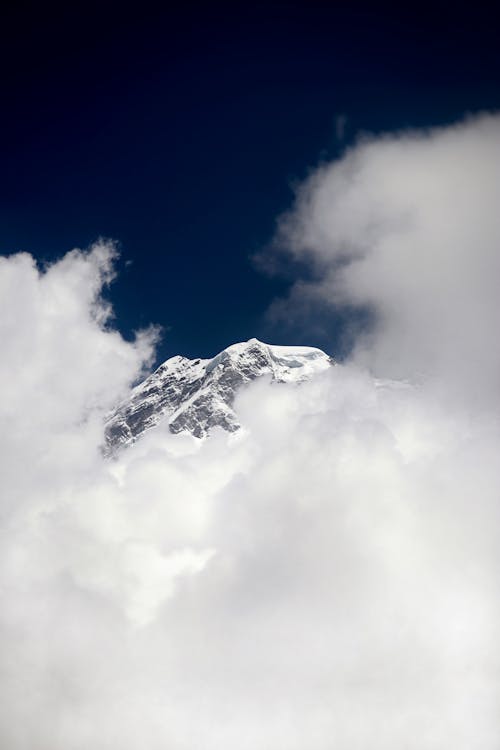 Mountain Peak behind White Cloud