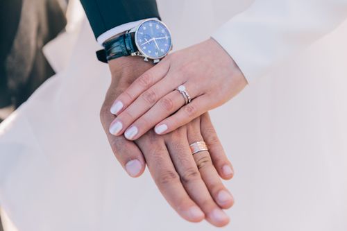 Free A close-up of a bride and groom's hands displaying their wedding rings in Sydney. Stock Photo