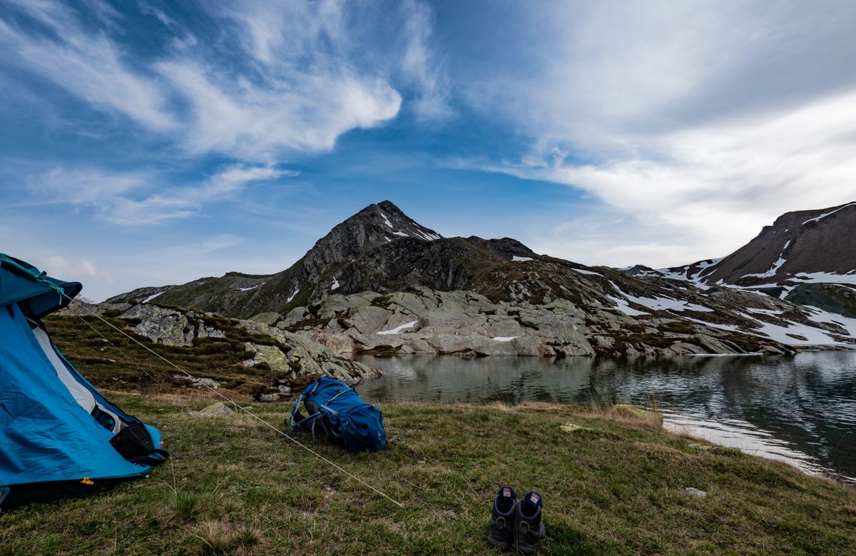 Tent camp by a scenic mountain lake
