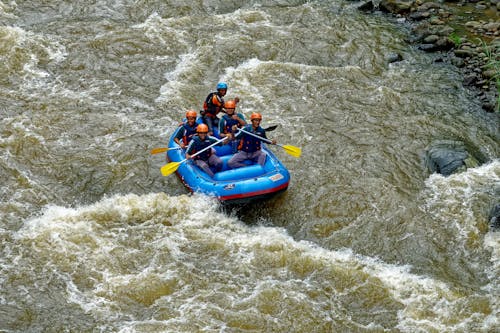 People Riding on Inflatable Boat