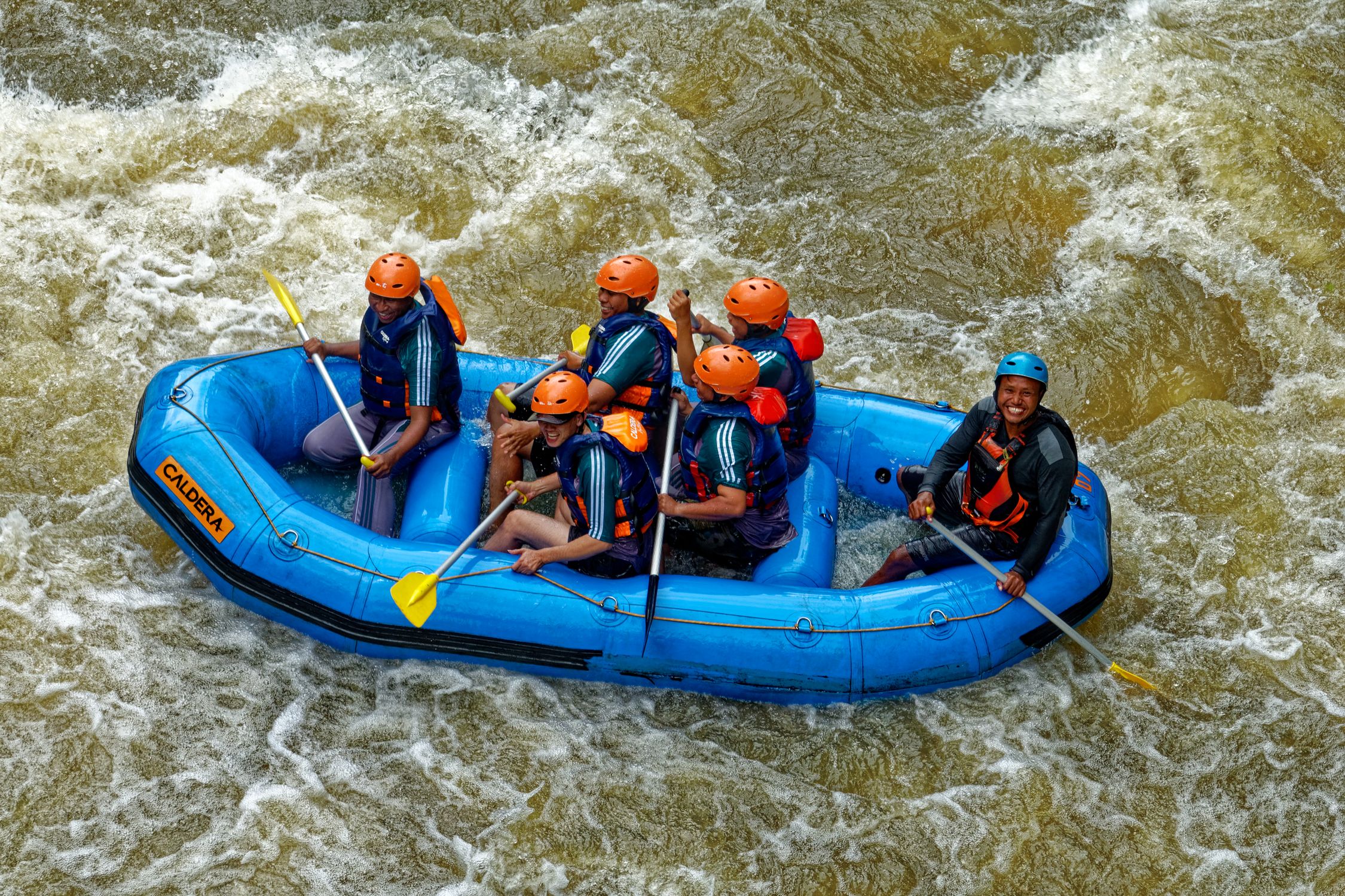 Person Riding Raft Group Of People Riding Blue Raft On Body Of Water · Free Stock Photo