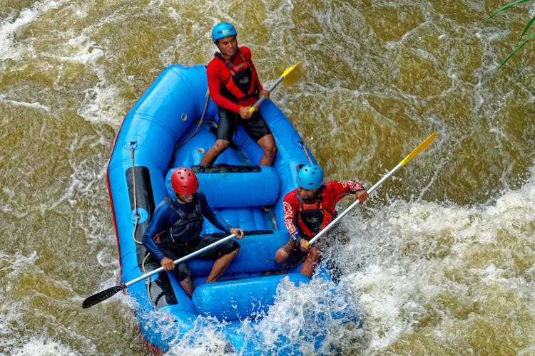 Group Of People Rafting