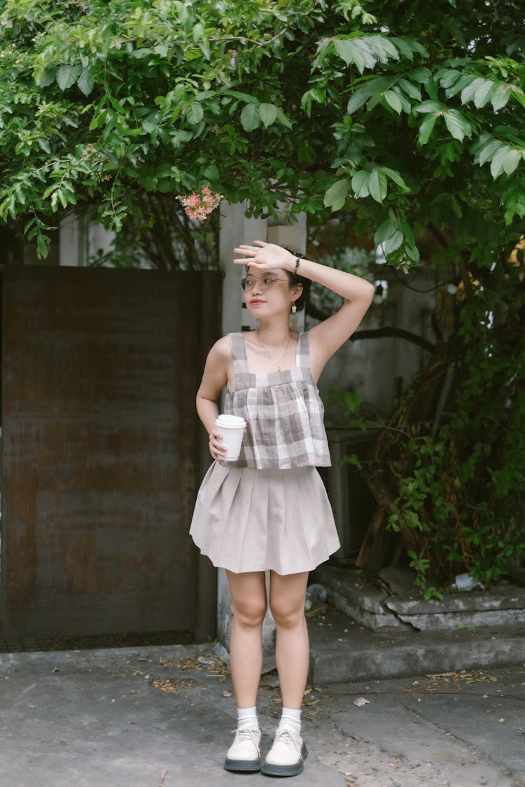 Model In Summer Blouse And Skirt