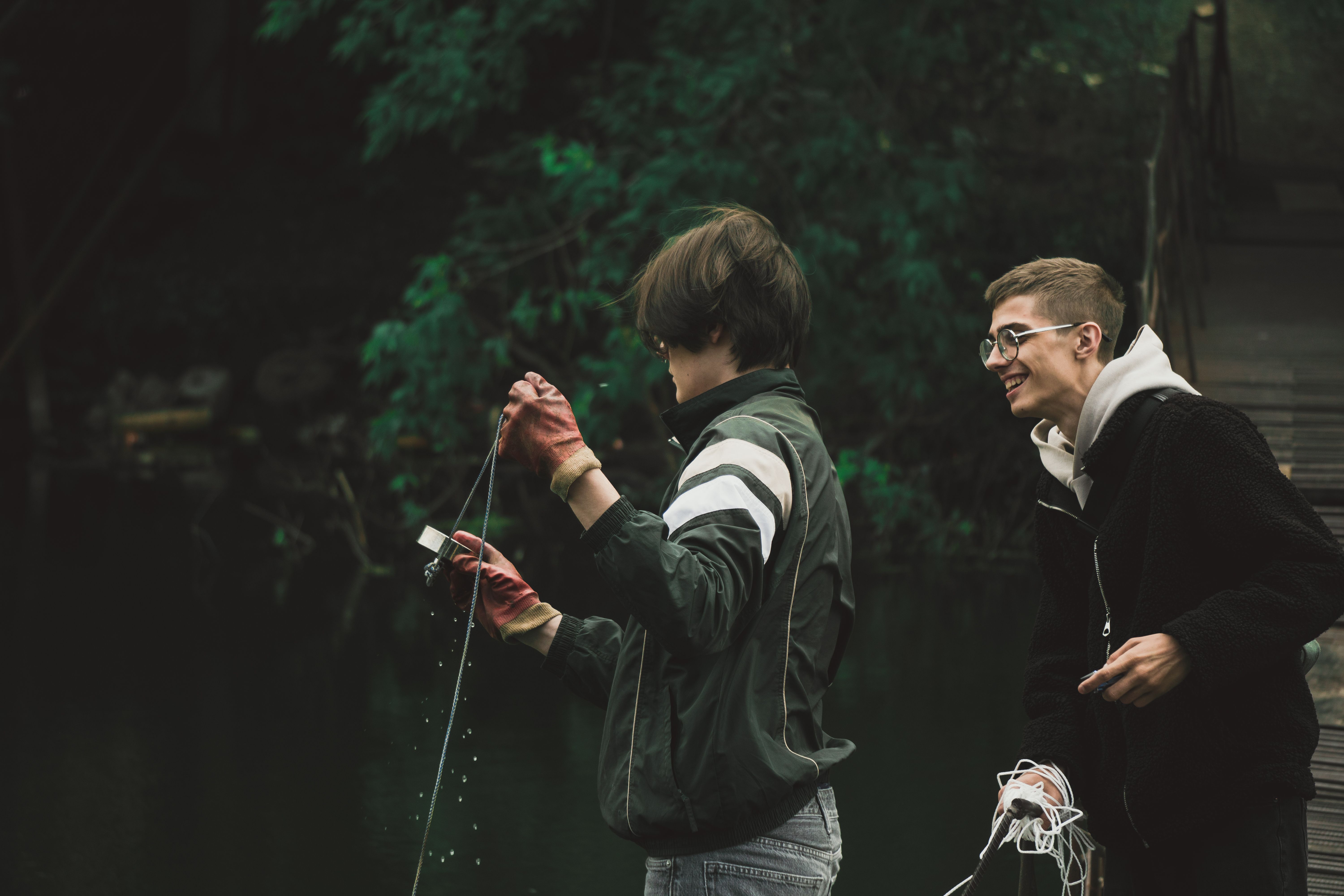 Smiling Men Holding Rope · Free Stock Photo