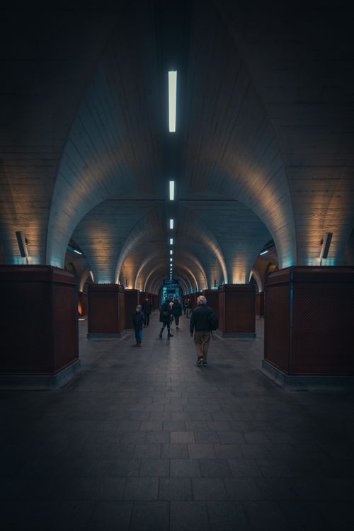 Free Modern underground corridor in London with architectural arches and ambient lighting. Stock Photo