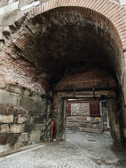 Cobblestone Street in Tunnel in Town